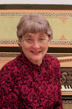 Photo of Dr. Vera Kochanowsky at her harpsichord